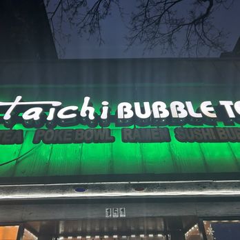 Taichi entrance with glowing neon green lights.