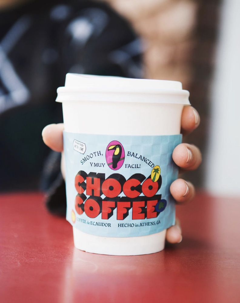 Paper Choco Pronto coffe cup with label that says "Choco Pronto."