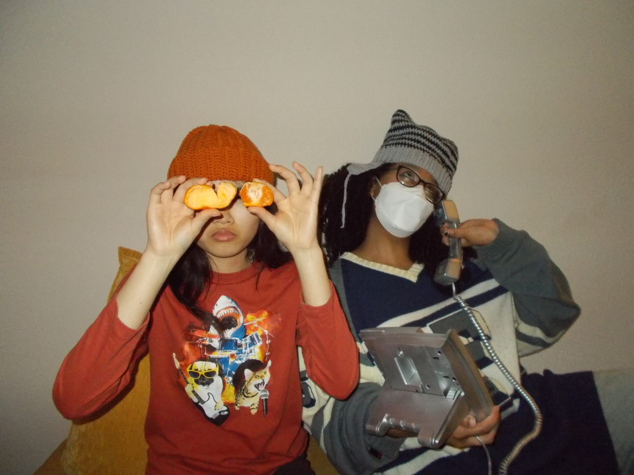 Hannah and Amanda wearing crochet hats.