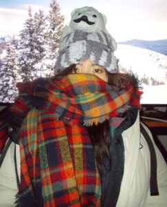 Amanda wearing the fluffy beanie and a scarf