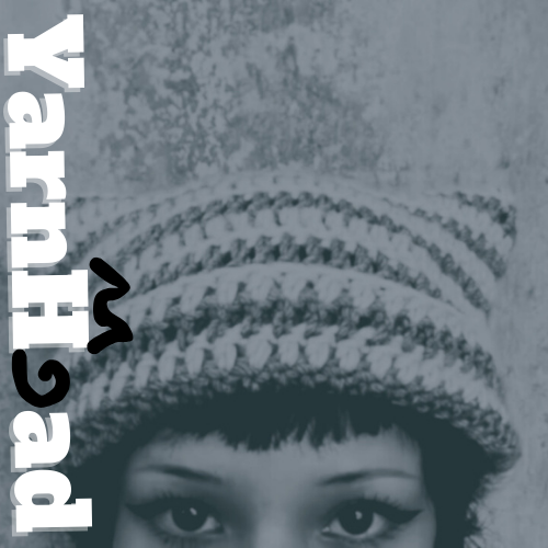 A girl with half her face showing wearing a cat beanie. The YARNHEAD logo is on the left side of the image.