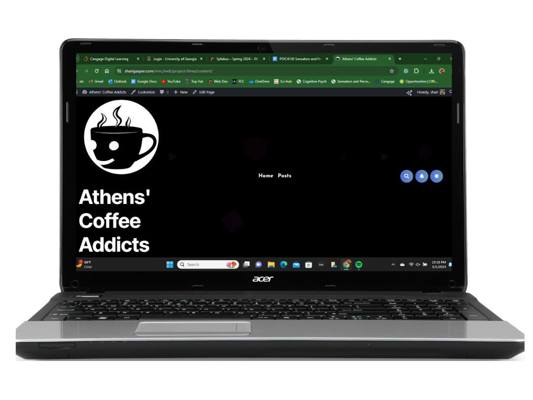 Laptop screen of Athens' Coffee Addicts website.