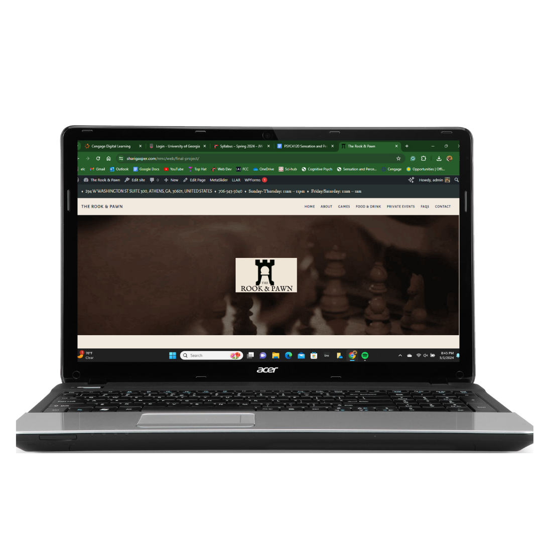 Laptop with The Rook & Pawn website.